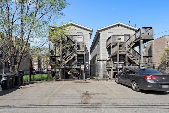 6139 S King Dr, Chicago, IL 60637 - view of building exterior with stairway and uncovered parking