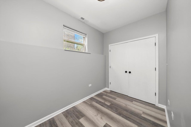 6139 S King Dr, Chicago, IL 60637 - unfurnished bedroom featuring wood finished floors and a closet
