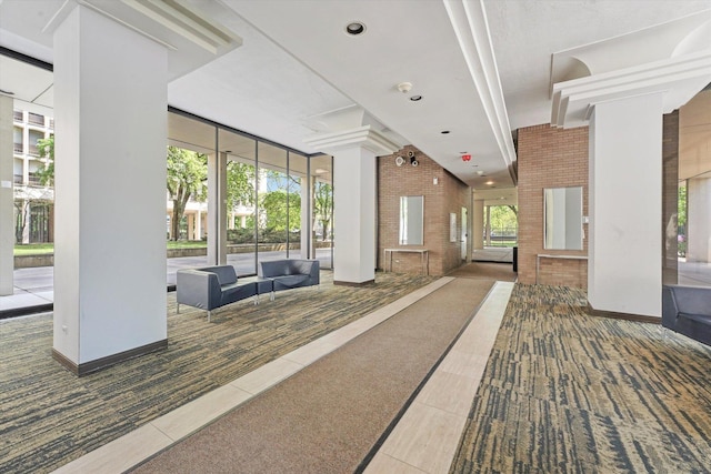 1450 E 55th Pl Unit 317S, Chicago, IL 60637 - common area featuring a towering ceiling and recessed lighting