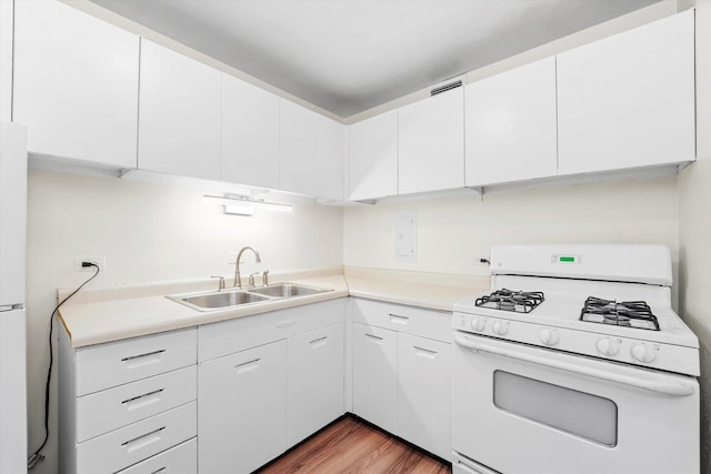 1450 E 55th Pl Unit 317S, Chicago, IL 60637 - kitchen with white appliances, wood finished floors, white cabinetry, and light countertops
