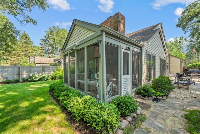 95 Warrington Dr, Lake Bluff, IL 60044 - view of side of home with a sunroom and a chimney