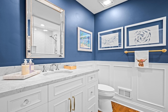 95 Warrington Dr, Lake Bluff, IL 60044 - full bath with tiled shower, vanity, wainscoting, and wood finished floors