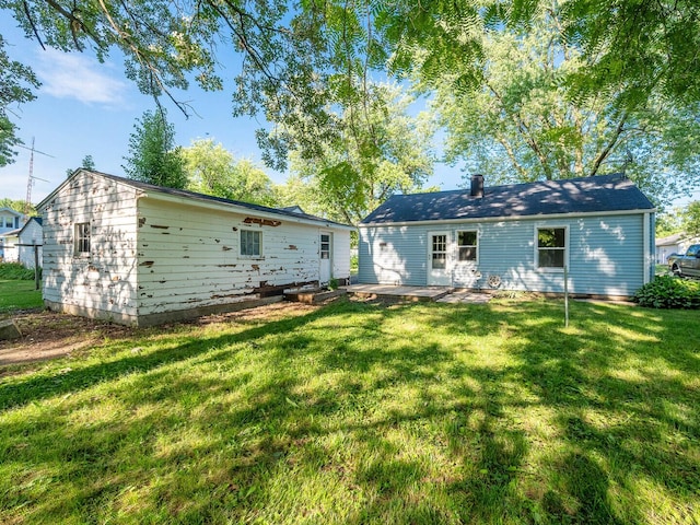 218 Chestnut St, Earlville, IL 60518 - back of property featuring a yard