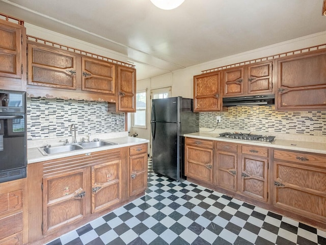 218 Chestnut St, Earlville, IL 60518 - kitchen with black appliances, dark flooring, extractor fan, and light countertops