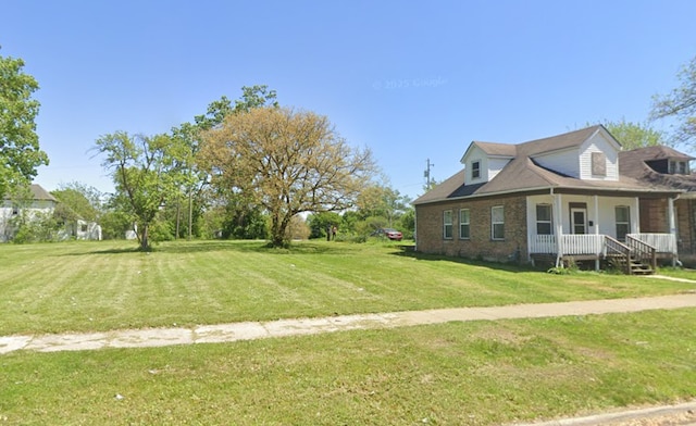 1613 Hanover St, Chicago Heights, IL 60411 - view of property exterior with a porch, a yard, and brick siding