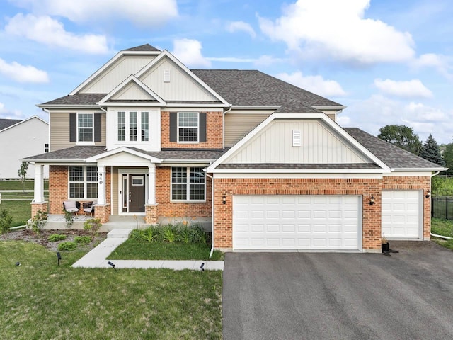 940 Treeline Dr, Algonquin, IL 60102 - craftsman inspired home featuring driveway, roof with shingles, brick siding, and board and batten siding