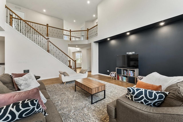 940 Treeline Dr, Algonquin, IL 60102 - living area with wood finished floors, stairway, a high ceiling, and recessed lighting