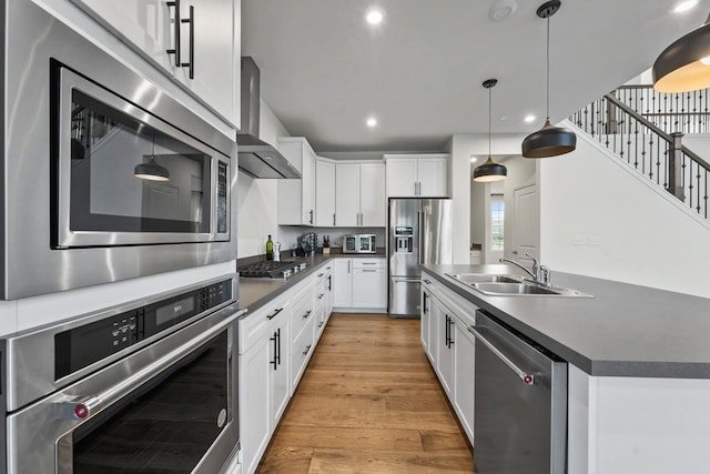940 Treeline Dr, Algonquin, IL 60102 - kitchen with appliances with stainless steel finishes, wall chimney exhaust hood, dark countertops, recessed lighting, and light wood finished floors