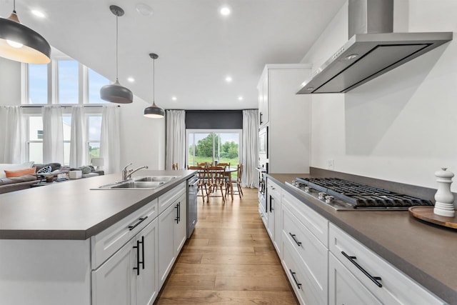 940 Treeline Dr, Algonquin, IL 60102 - kitchen with wall chimney range hood, appliances with stainless steel finishes, light wood-type flooring, recessed lighting, and white cabinetry