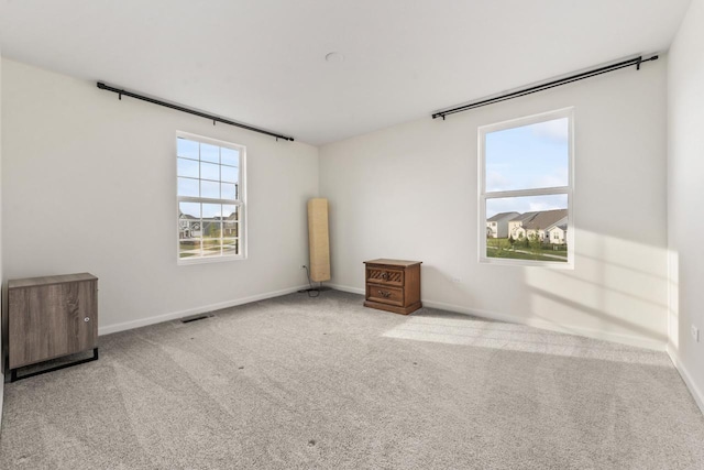 940 Treeline Dr, Algonquin, IL 60102 - carpeted empty room featuring baseboards