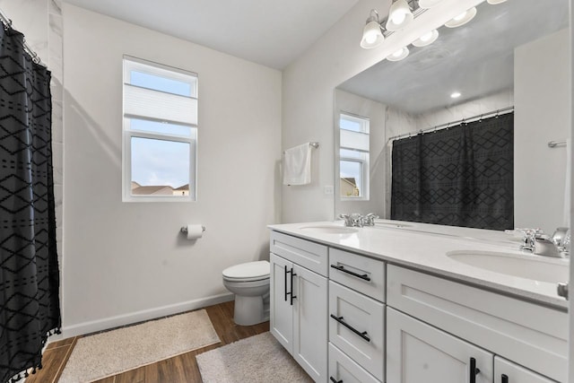 940 Treeline Dr, Algonquin, IL 60102 - full bathroom with healthy amount of natural light, wood finished floors, double vanity, and curtained shower