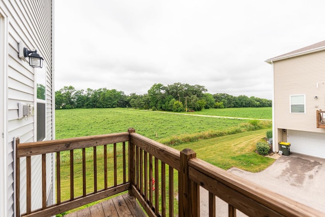 2551 Bella Dr, Pingree Grove, IL 60140 - wooden terrace featuring a garage, a rural view, and a lawn