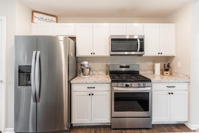 2551 Bella Dr, Pingree Grove, IL 60140 - kitchen featuring stainless steel appliances, white cabinets, and dark wood-type flooring