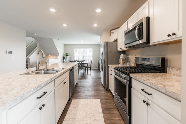 2551 Bella Dr, Pingree Grove, IL 60140 - kitchen with appliances with stainless steel finishes, light countertops, dark wood-type flooring, white cabinetry, and recessed lighting