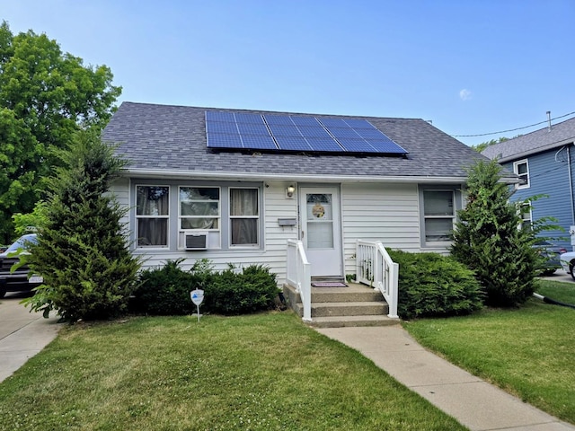 732 Pierce St, Aurora, IL 60505 - view of front facade with roof with shingles, roof mounted solar panels, and a front yard