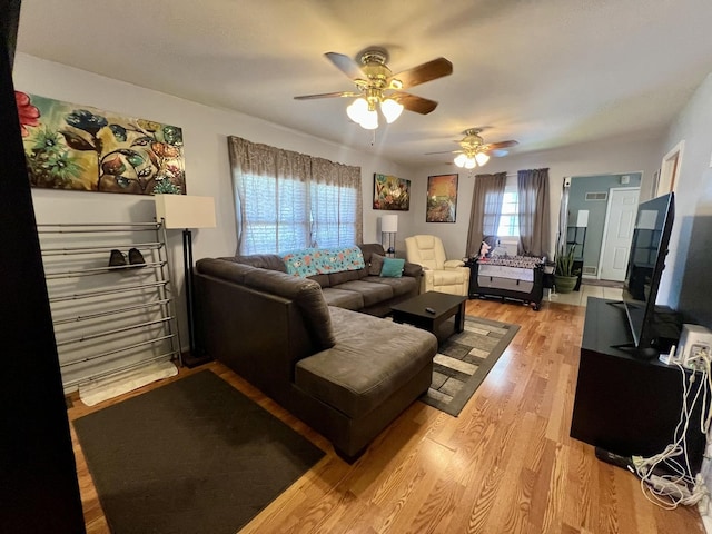 302 Kelly Ct, Champaign, IL 61821 - living room featuring a ceiling fan and light wood-style flooring