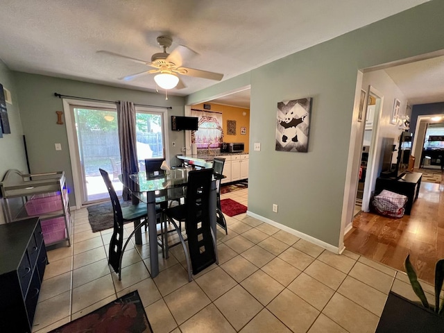 302 Kelly Ct, Champaign, IL 61821 - dining space featuring light tile patterned floors and a ceiling fan