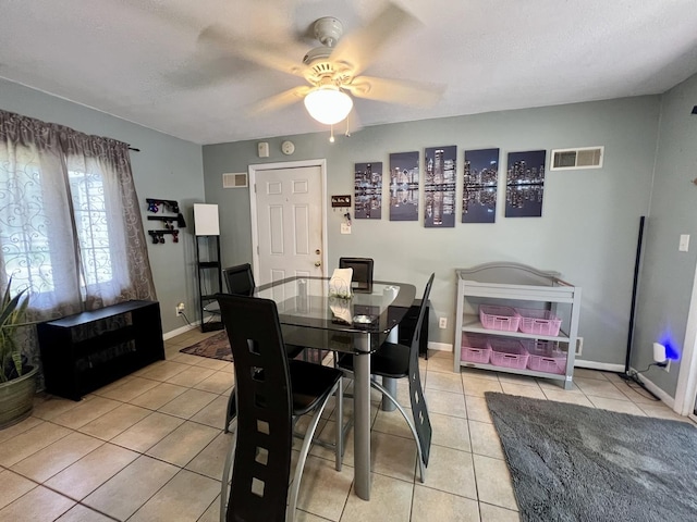 302 Kelly Ct, Champaign, IL 61821 - dining space with light tile patterned floors and ceiling fan