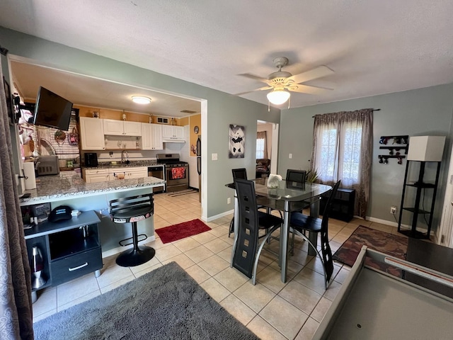 302 Kelly Ct, Champaign, IL 61821 - dining space featuring light tile patterned floors and ceiling fan