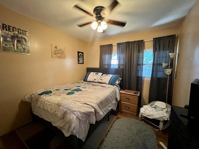 302 Kelly Ct, Champaign, IL 61821 - bedroom featuring dark wood-type flooring and a ceiling fan