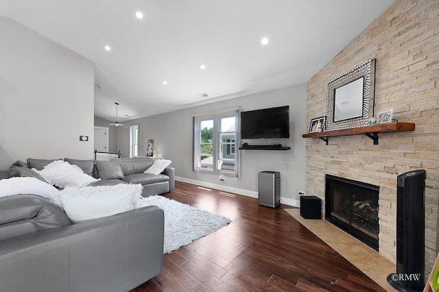1869 Pebble Beach Cir Unit A, Elk Grove Village, IL 60007 - living area featuring a stone fireplace, vaulted ceiling, dark wood-style floors, and recessed lighting