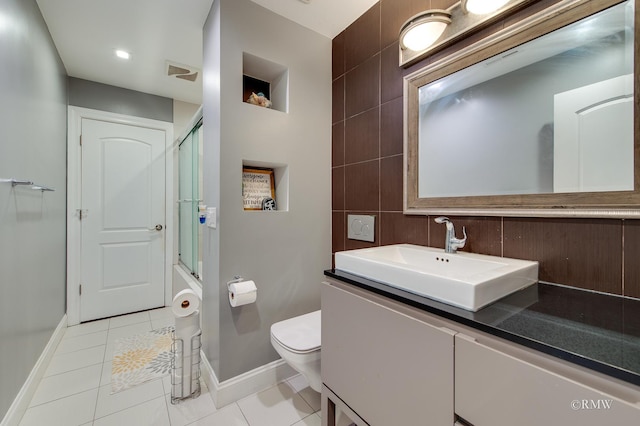 1869 Pebble Beach Cir Unit A, Elk Grove Village, IL 60007 - full bath featuring vanity, tile patterned floors, tile walls, and shower / bath combination with glass door
