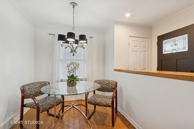 147 S Prospect St, Wheaton, IL 60187 - dining room with wood finished floors, a chandelier, and crown molding