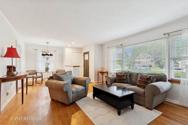 147 S Prospect St, Wheaton, IL 60187 - living room featuring light wood finished floors, a chandelier, recessed lighting, and crown molding