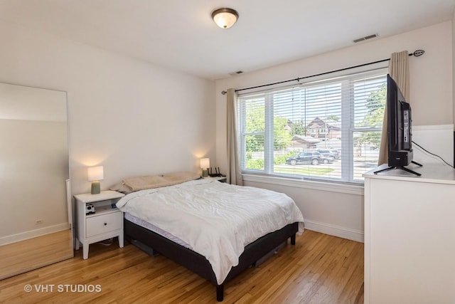 5416 W Windsor Ave Unit 1N, Chicago, IL 60630 - bedroom with light wood-type flooring and baseboards