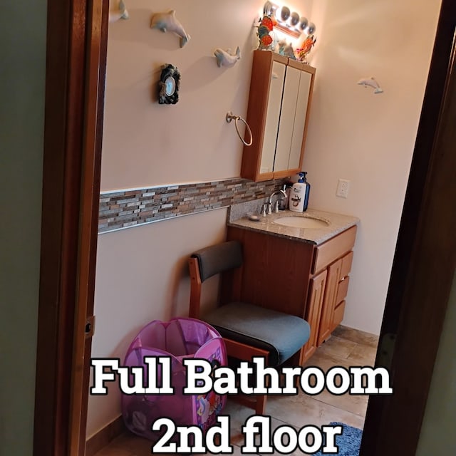 100 Prince Ct, Poplar Grove, IL 61065 - bathroom with vanity and backsplash