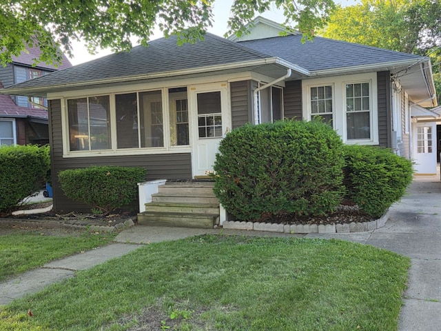 2117 11th St, Peru, IL 61354 - view of front of property with a front yard and roof with shingles