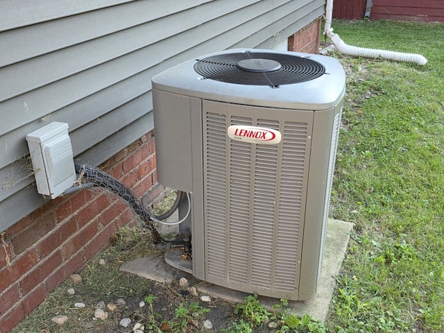 2117 11th St, Peru, IL 61354 - exterior view of a cooling unit and crawl space