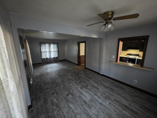 2117 11th St, Peru, IL 61354 - unfurnished living room featuring ceiling fan and dark wood-style floors