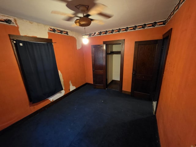 2117 11th St, Peru, IL 61354 - unfurnished bedroom with baseboards and a ceiling fan