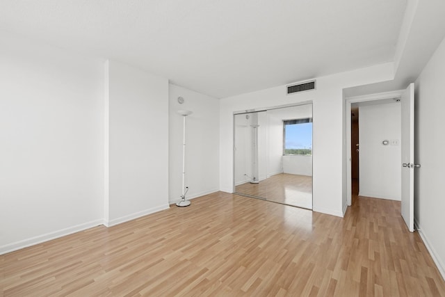 7234 W N Ave Unit 1610, Elmwood Park, IL 60707 - unfurnished bedroom featuring light wood-style flooring and a closet