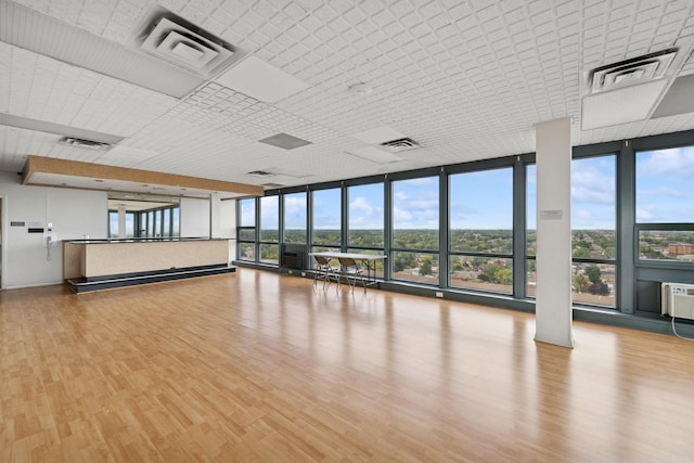 7234 W N Ave Unit 1610, Elmwood Park, IL 60707 - unfurnished room featuring expansive windows and wood finished floors