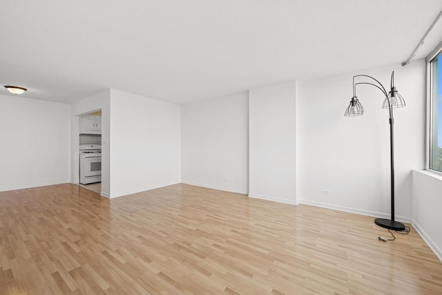 7234 W N Ave Unit 1610, Elmwood Park, IL 60707 - unfurnished living room with light wood-style floors and healthy amount of natural light