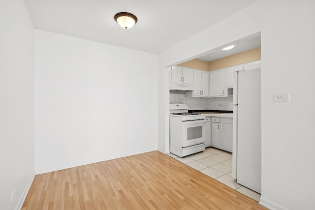 7234 W N Ave Unit 1610, Elmwood Park, IL 60707 - kitchen with white appliances, under cabinet range hood, white cabinetry, and light wood finished floors