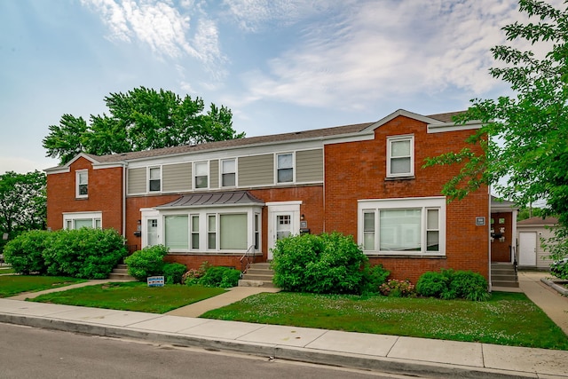5641 W Carmen Ave, Chicago, IL 60630 - townhome / multi-family property with brick siding and a front yard