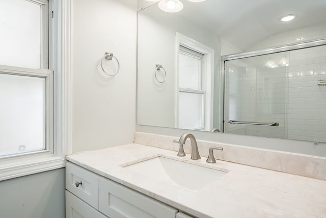 5641 W Carmen Ave, Chicago, IL 60630 - bathroom featuring vanity, tiled shower, lofted ceiling, and recessed lighting