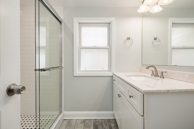 5641 W Carmen Ave, Chicago, IL 60630 - full bathroom with vanity, a shower stall, and a chandelier