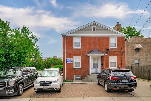 5641 W Carmen Ave, Chicago, IL 60630 - view of front of house with brick siding and a chimney