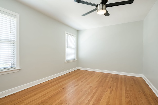 5641 W Carmen Ave, Chicago, IL 60630 - empty room with light wood-style flooring and ceiling fan
