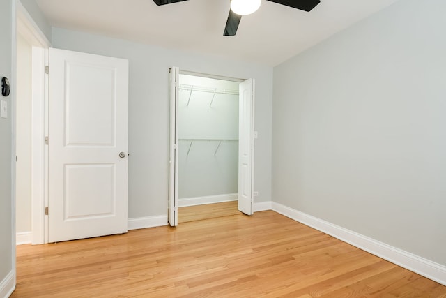 5641 W Carmen Ave, Chicago, IL 60630 - unfurnished bedroom with light wood-type flooring, ceiling fan, and a closet