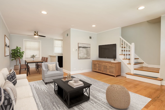 5641 W Carmen Ave, Chicago, IL 60630 - living area with stairway, light wood finished floors, ornamental molding, recessed lighting, and a ceiling fan