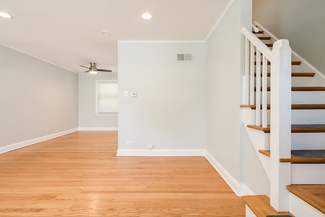 5641 W Carmen Ave, Chicago, IL 60630 - staircase featuring ornamental molding, a ceiling fan, wood finished floors, and recessed lighting