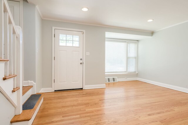 5641 W Carmen Ave, Chicago, IL 60630 - entrance foyer with crown molding, light wood-style floors, stairway, and recessed lighting