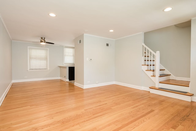 5641 W Carmen Ave, Chicago, IL 60630 - unfurnished living room featuring stairs, ornamental molding, light wood-style flooring, ceiling fan, and recessed lighting