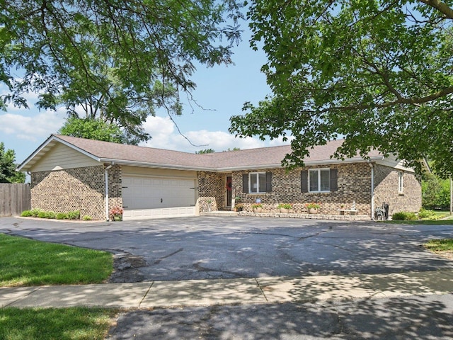 2720 Hobson Rd, Woodridge, IL 60517 - single story home featuring asphalt driveway, brick siding, and a garage