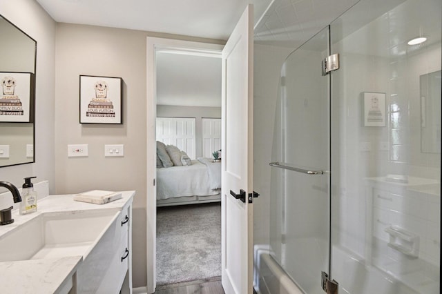 2720 Hobson Rd, Woodridge, IL 60517 - bathroom with vanity, ensuite bathroom, combined bath / shower with glass door, and wood finished floors